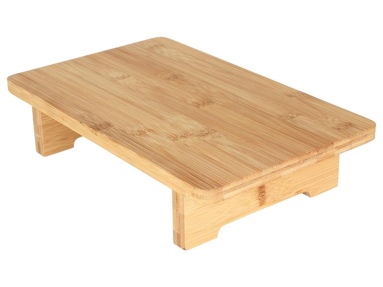 Support d'écran ou petite table en bambou avec une finition grain de bois naturel.
