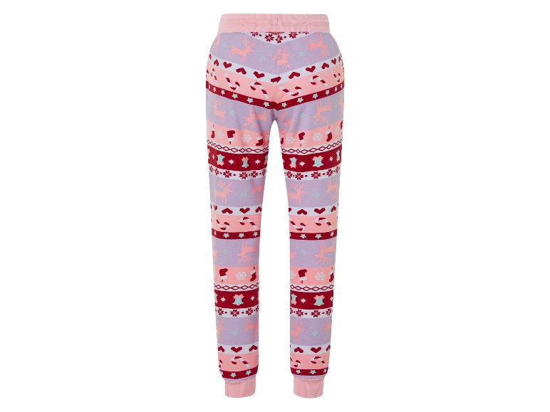 Un pantalon de jogging rose avec un imprimé de Noël de rennes.