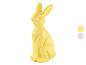 Figurine de lapin de Pâques jaune avec deux échantillons de couleur à droite.