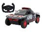 Une voiture de rallye Audi e-tron grise avec des détails rouges et sa télécommande.