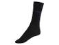 Une paire de chaussettes noires de la marque Sunday.
