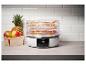 Déshydrateur alimentaire SilverCrest avec des fruits sur les plateaux.