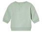 Un t-shirt à manches longues vert clair pour bébé
