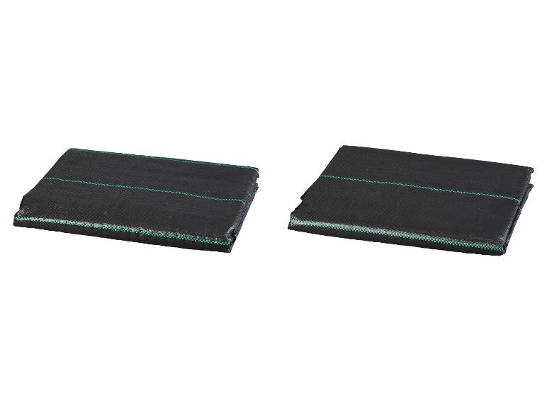 Deux toiles de paillage noires pliées avec des rayures bleu-vert.