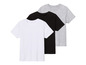 Trois t-shirts unis en blanc, noir et gris.