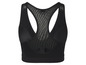 Soutien-gorge de sport noir avec empiècements en mesh.