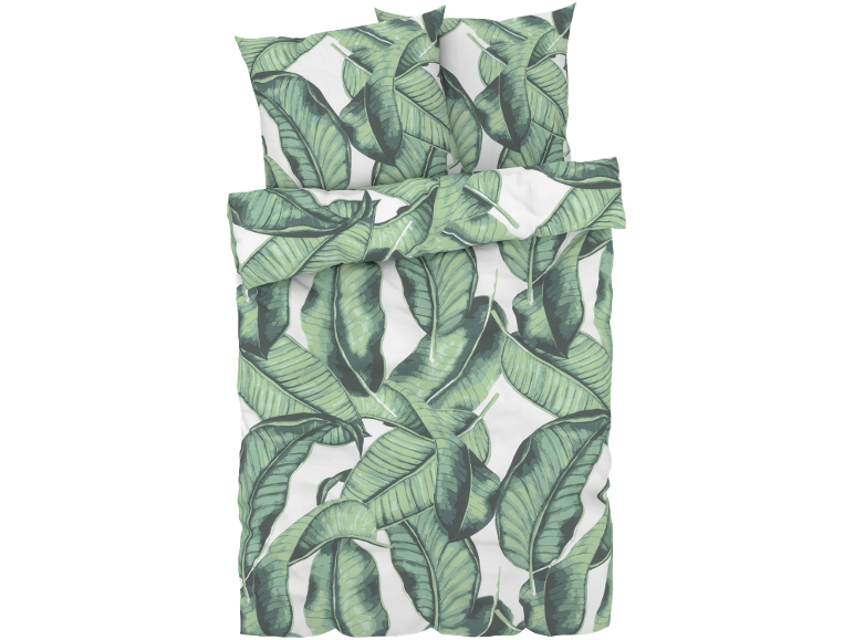 Parure de lit avec motif de feuilles de bananier vertes sur fond blanc.