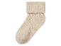 Chaussette en laine beige avec bord côtelé.