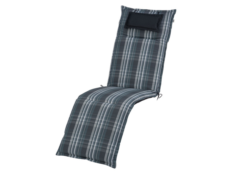 Un coussin de chaise longue gris à carreaux