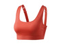 Un soutien-gorge de sport orange avec des bretelles larges.