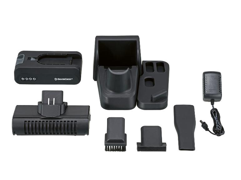 Base de chargement pour aspirateur à main avec accessoires et adaptateur secteur.