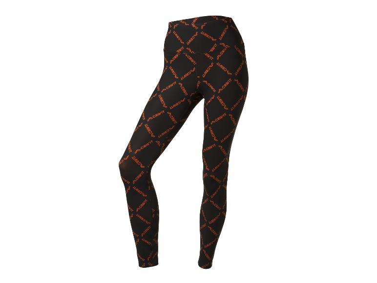 Legging Crivit noir avec logo orange répété.