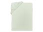 Drap-housse vert clair avec coin élastique et étiquette.