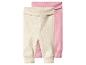 Deux leggings côtelés pour bébé, un beige et un rose.