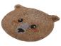 Tapis marron en forme d'ours avec yeux et nez brodés.