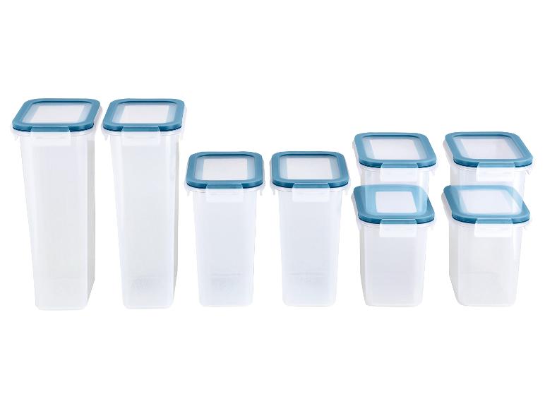 Ensemble de boîtes de conservation en plastique transparent avec couvercles bleus, diverses tailles.