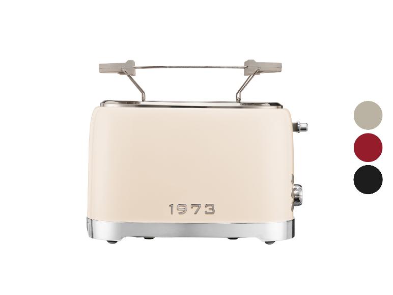 Grille-pain crème avec détails métalliques et le texte '1973'.