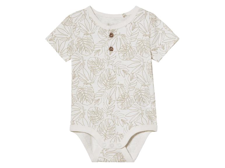 Body bébé à manches courtes, motif feuilles tropicales beige.