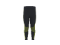 Legging de sport noir et vert lime avec empiècements texturés aux genoux.