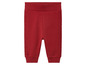 Pantalon en tricot rouge avec des détails sur les côtés.