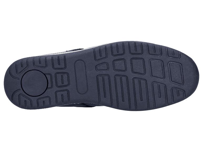 Semelle de chaussure foncée avec motif de traction géométrique sur fond blanc.