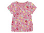 T-shirt rose à manches courtes avec un imprimé tropical d'ananas, pastèque et citrons.