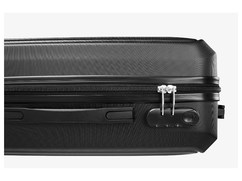 Valise noire avec fermeture éclair et serrure à combinaison.