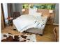 Oreiller BeCo Medibett et couette dans une chambre chaleureuse.