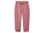 Pantalon de jogging rose pour femme avec cordon de serrage et poches.