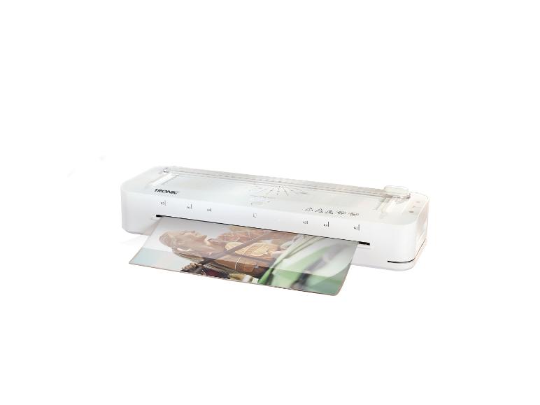 Plastifieuse blanche avec une photo laminée d'une femme souriante.