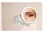 Miroir lumineux mural avec bras extensible, idéal pour le maquillage.