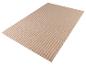 Un tapis beige avec une surface nervurée.