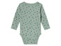 Un body bébé à manches longues avec un motif à pois verts.
