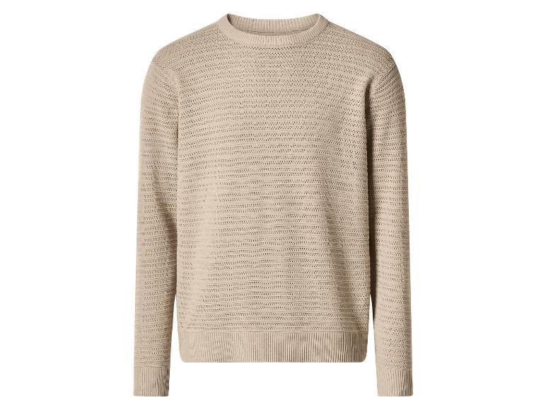 Pull tricoté beige à manches longues avec un motif texturé