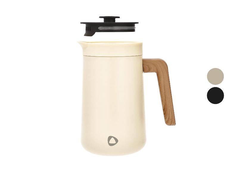 Carafe isotherme crème avec poignée en bois et couvercle noir.