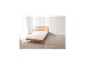 Matelas en mousse confort LIVARNO HOME Easy sur un lit en bois dans une pièce lumineuse.