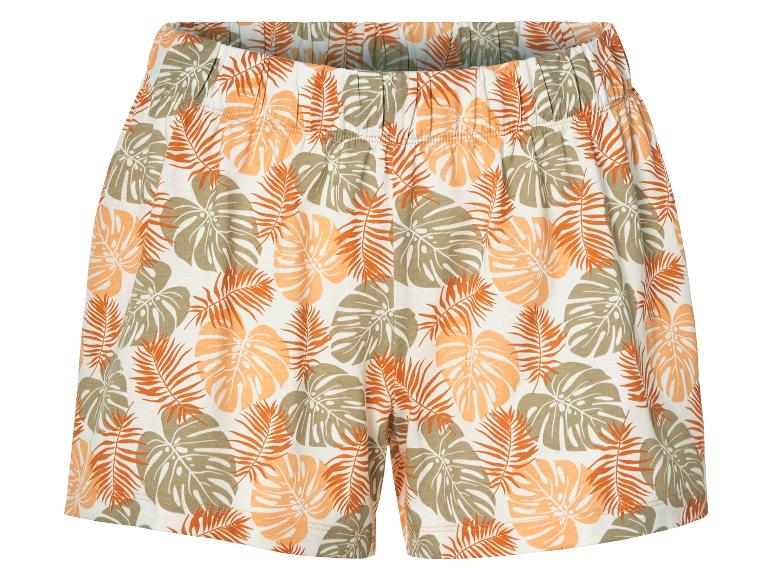 Shorts imprimés avec un motif tropical de feuilles.