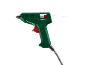 Pistolet à colle chaude vert avec bâton de colle blanc et gâchette rouge.