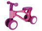 Un vélo d'apprentissage rose avec des roues blanches pour les jeunes enfants.