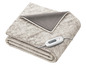 Une couverture chauffante Sanitas beige, avec une texture moelleuse et pelucheuse