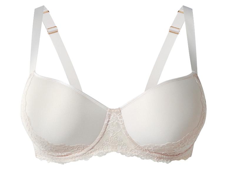 Soutien-gorge beige avec détails en dentelle et bretelles réglables.