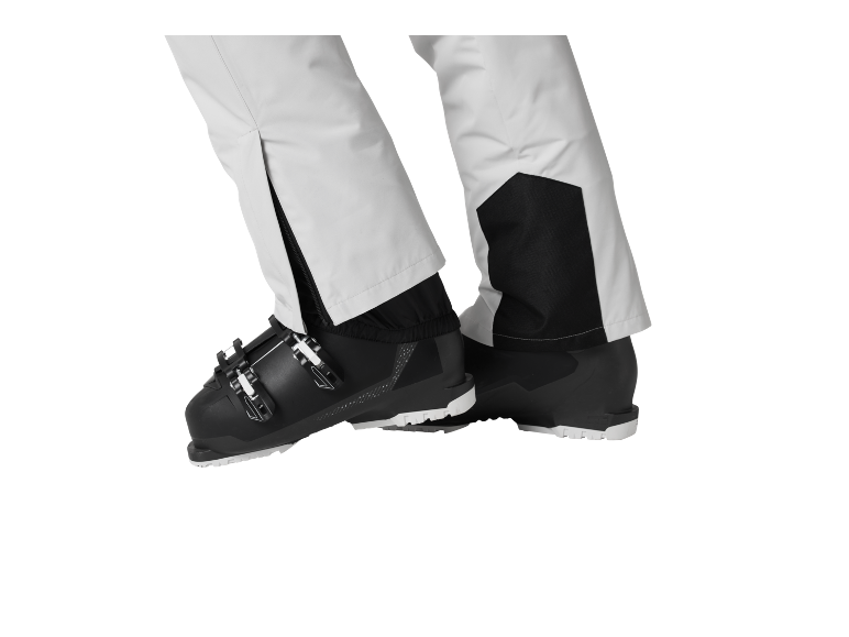 Pantalon de ski et chaussures de ski en noir et blanc