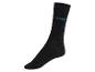 Une chaussette noire avec l'inscription 'FRIDAY'.