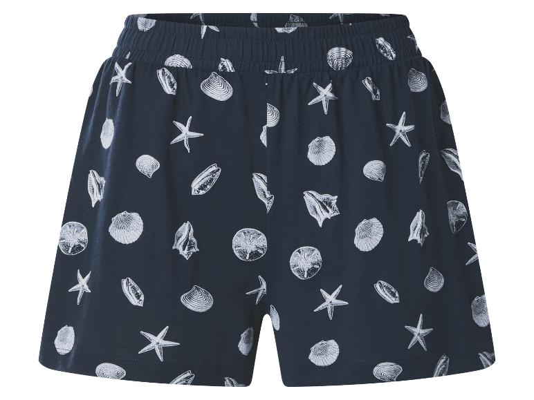 Short bleu foncé avec motif coquillages et étoiles de mer blancs, taille élastique.