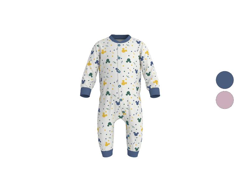 Grenouillère blanche pour bébé avec des motifs bleus, jaunes et verts.