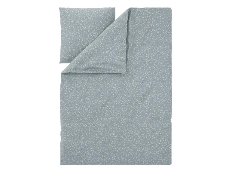 Parure de lit bleu clair avec motif floral blanc
