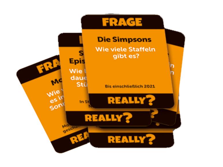 Cartes de jeu Really ? avec des questions sur les Simpsons.