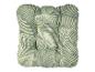 Coussin de siège vert et blanc à motif de feuilles.