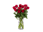 Un bouquet de roses rouges fraîches dans un vase en verre transparent.