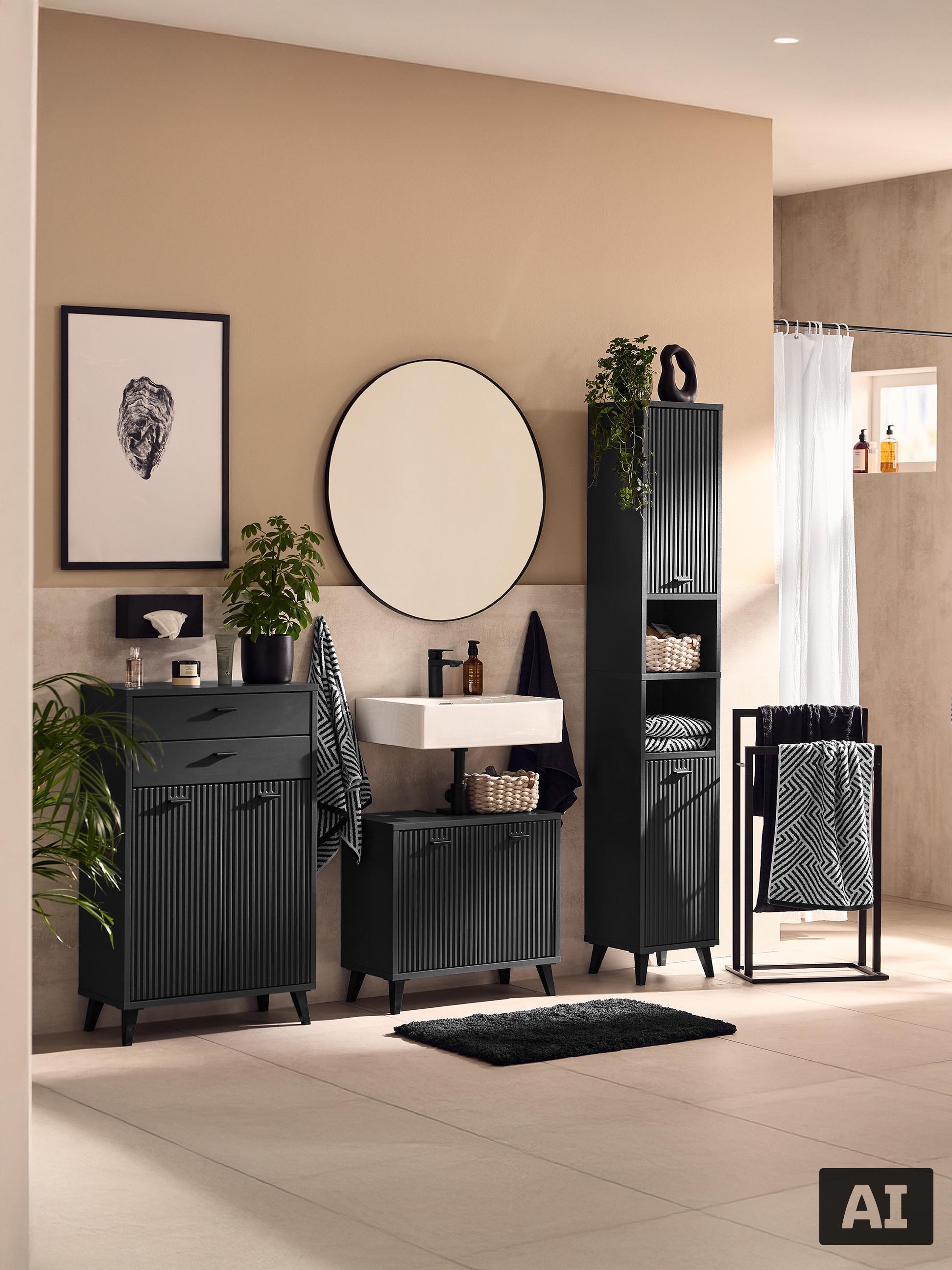 Salle de bain avec meubles noirs, miroir, lavabo et porte-serviettes.
